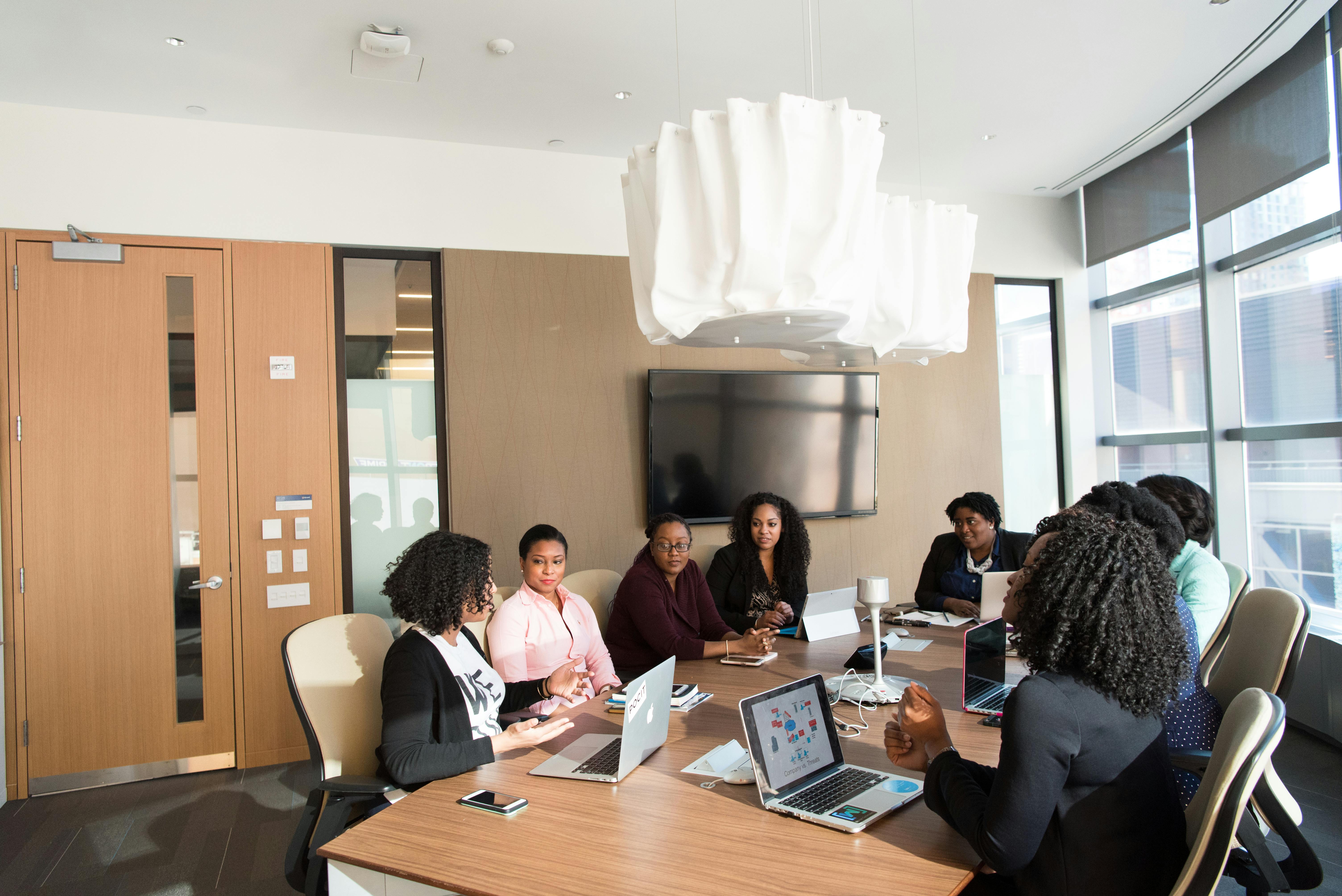 IT professionals working on laptops in office environment